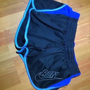 Nike women’s black and purple/blue running shorts